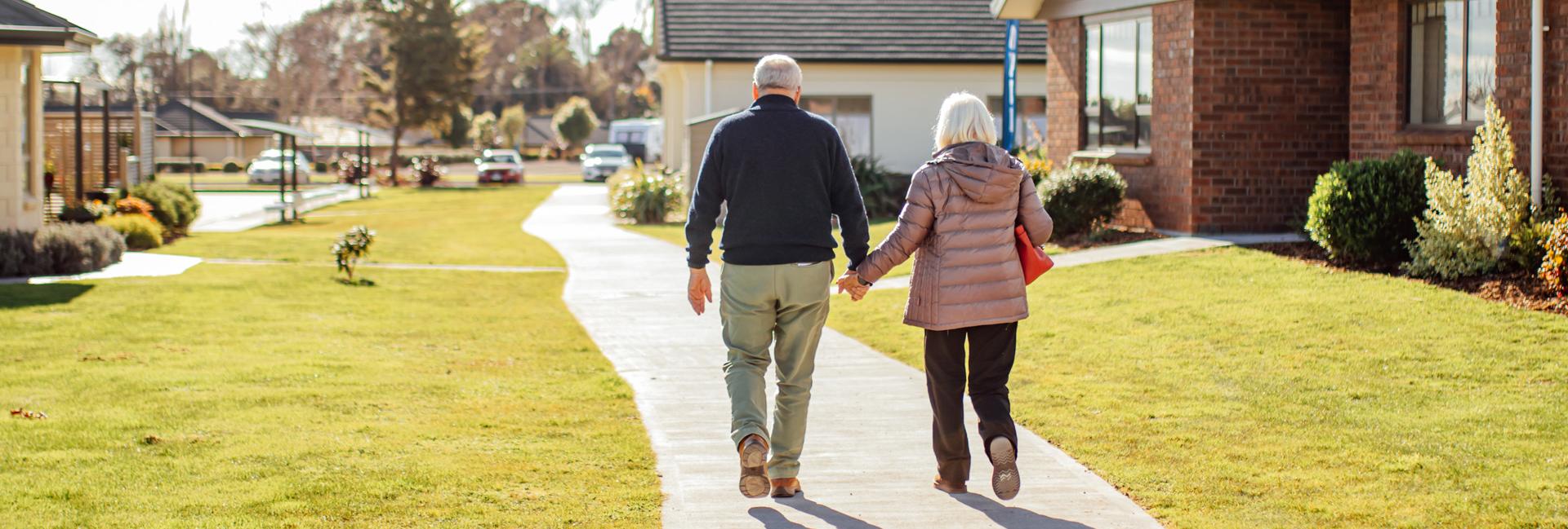 Couple Walking past some Speldhurst Houses