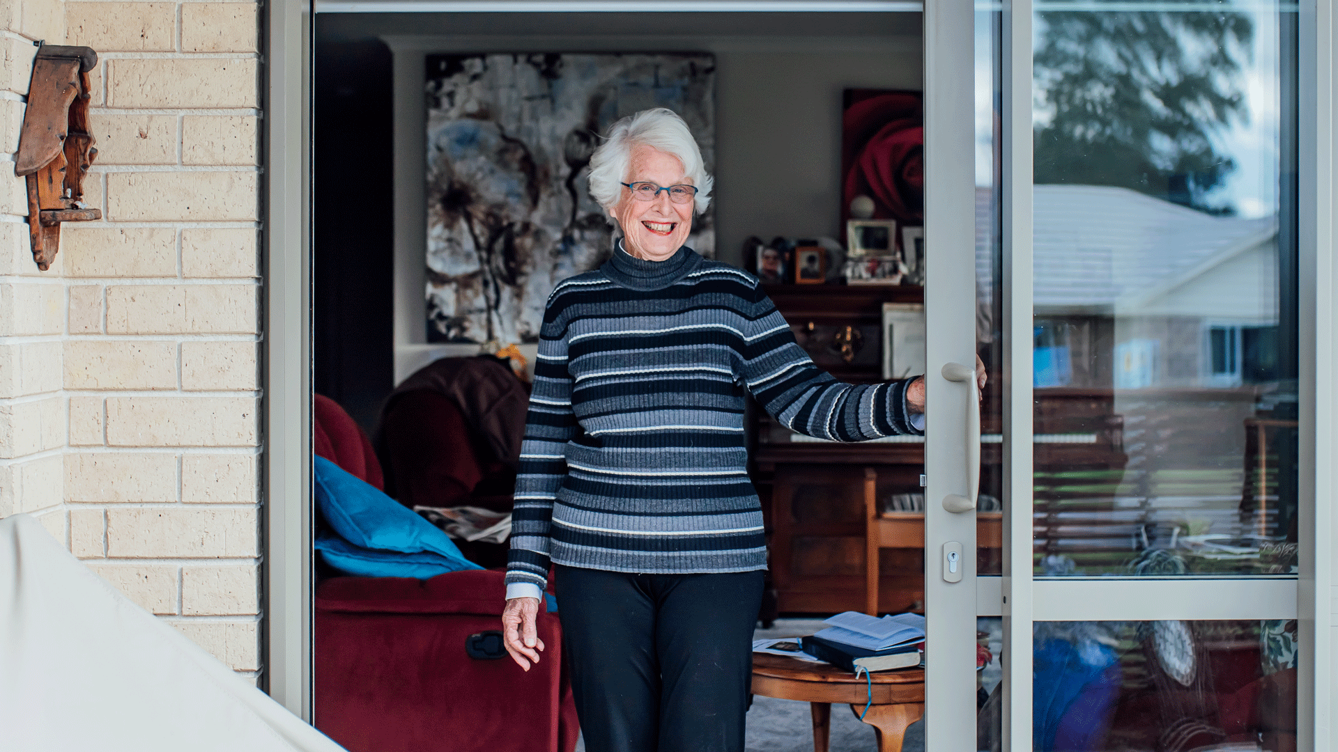 Live Here - lady standing in her home